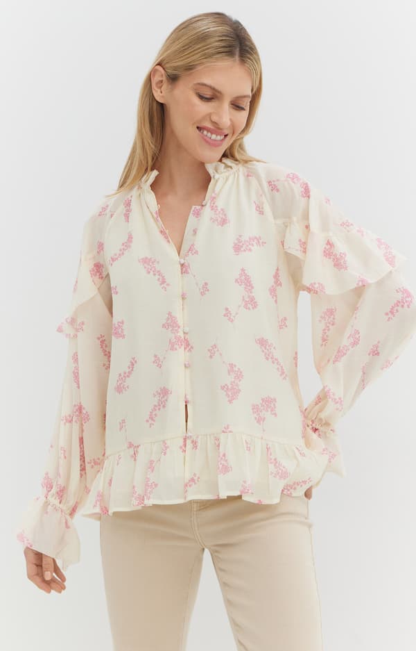 Blommig blus med volanger XS