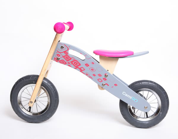 lyserød løbecykel