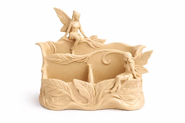 Beige skrivbordsarrangör med älvmotiv