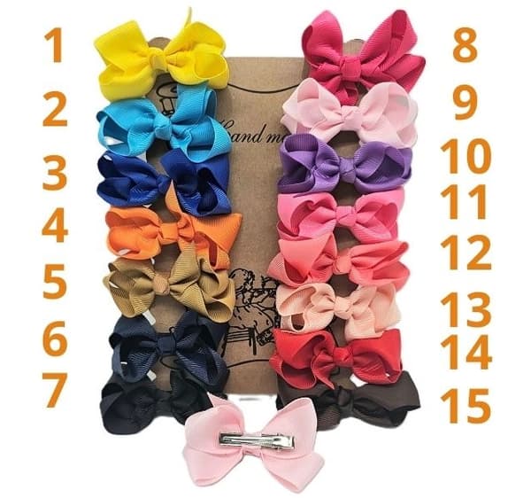 2 rosa hårspännen med rosett