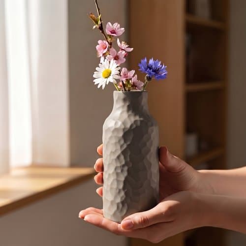 Suddig grå vas för blommor, snygg
