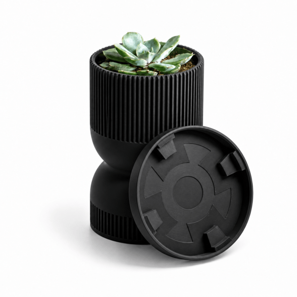 Sort timeglas-urtepotte med moderne underkop
