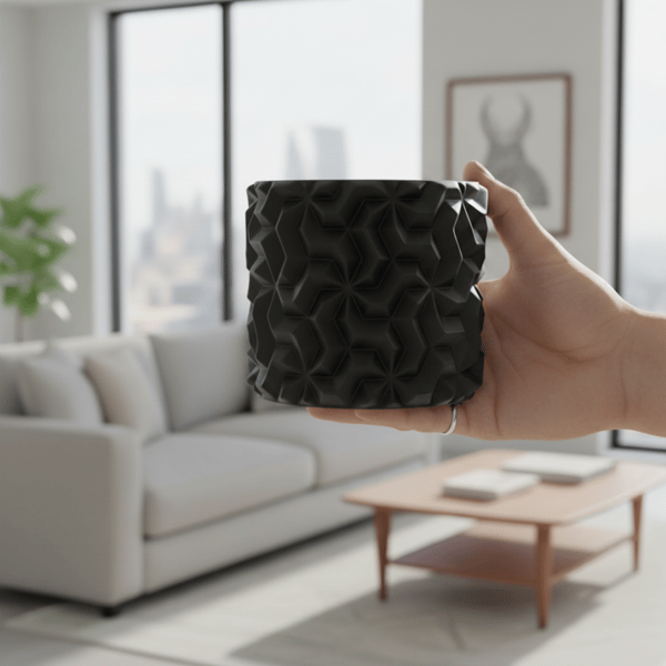 Sort urtepotteskjuler med 3D geometrisk mønster til loftplanter