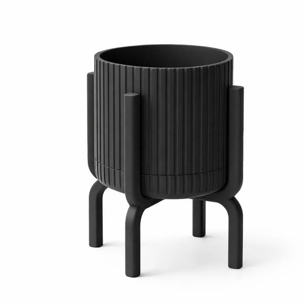 Modern, räfflad svart blomkruka med växtställ