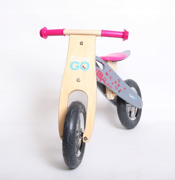 lyserød løbecykel