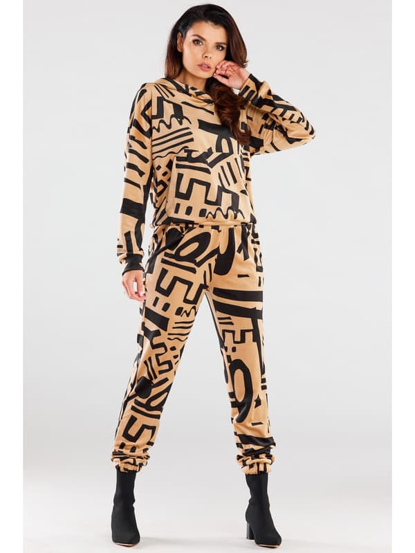 Fløjlsbukser, beige med sort print, størrelse L