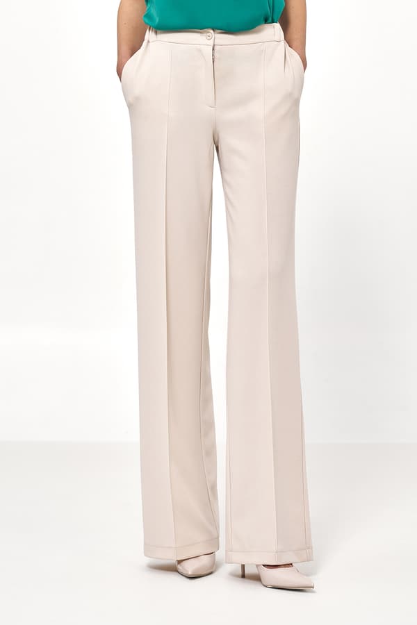 Beige löst skurna byxor 40