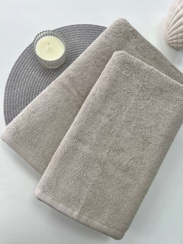 2x beige badhanddukar i bomull 70x140 50x90