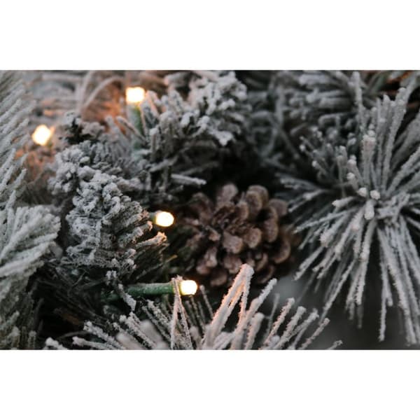 Julekrans med LED-lys og den første sne-effekt