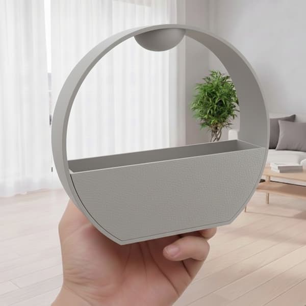 Grå urtepotte med vandingssystem til planter med stenlook