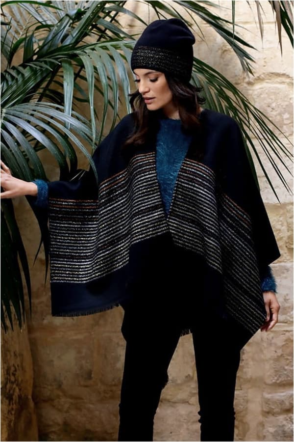 LUMINESCERANDE PONCHO med fransar