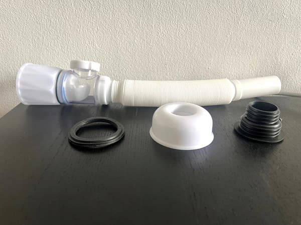 Fleksibel vandlås med tank