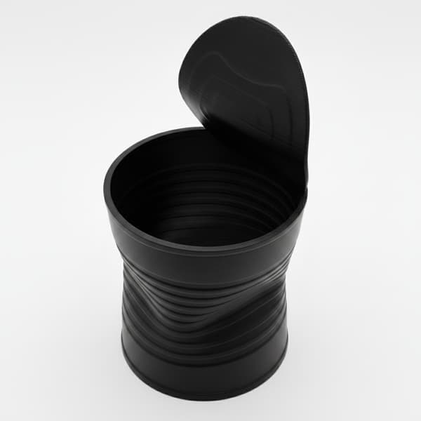 Sort urtepotte formet som en knust plantedåse, moderne design