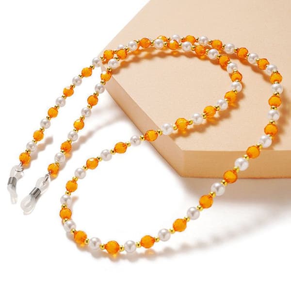 Hängeögonbryn med orange pärlor
