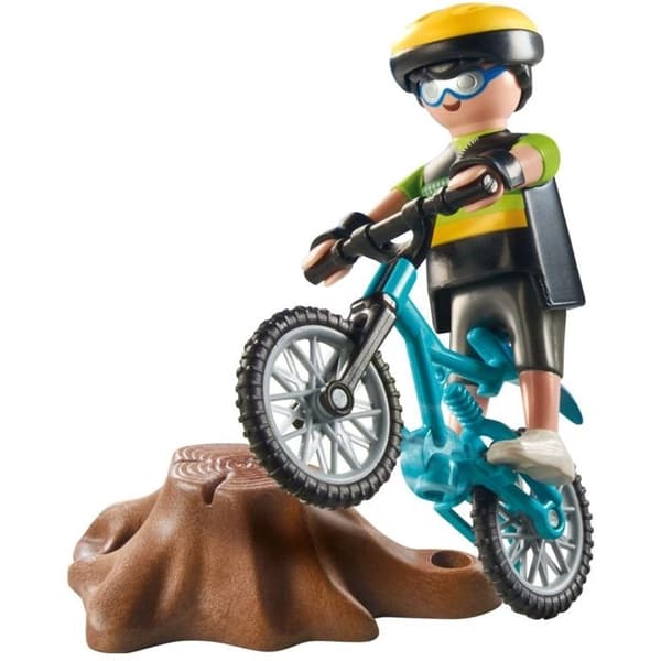 Cyklist med mountainbike och trädstam