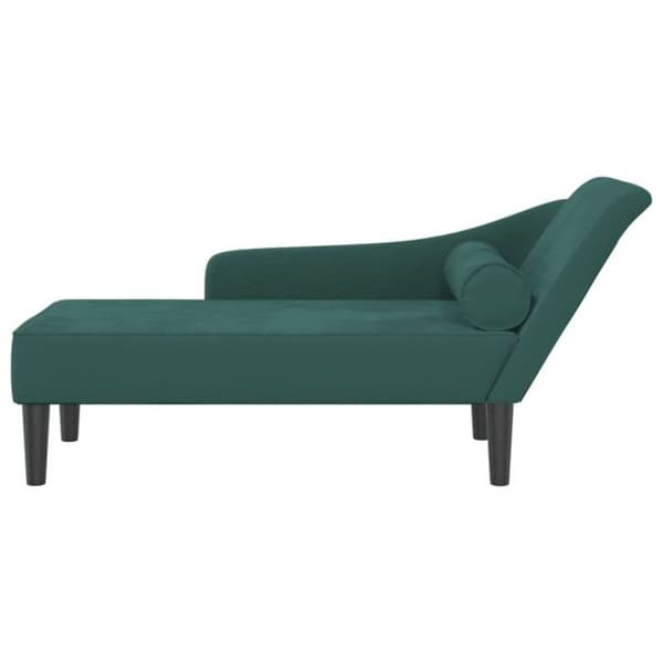 Soffa med mörkgrön sammetskuddar