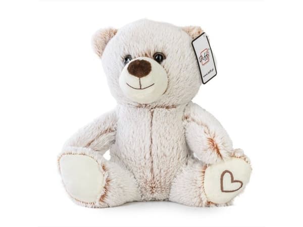 Beige bamse som sitter med hjerte