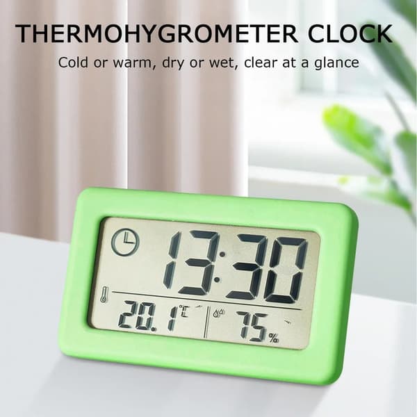 Digitalt vækkeur med termometer og hygrometer, LED-display, der viser indendørs luftfugtighed, grøn
