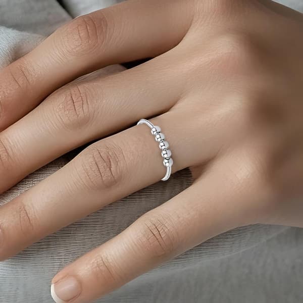 Justerbar antistressring med roterbara pärlor Silver