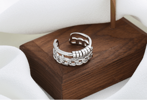 Justerbar antistressring med roterbare ringer Silver