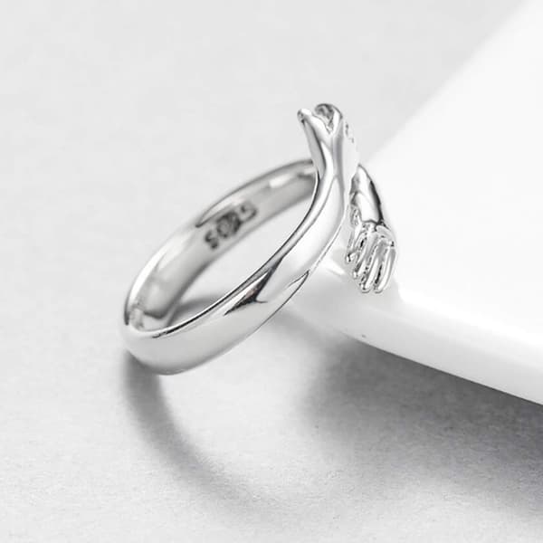 Fingerring med krammende hænder sølvfarvet 2-pack
