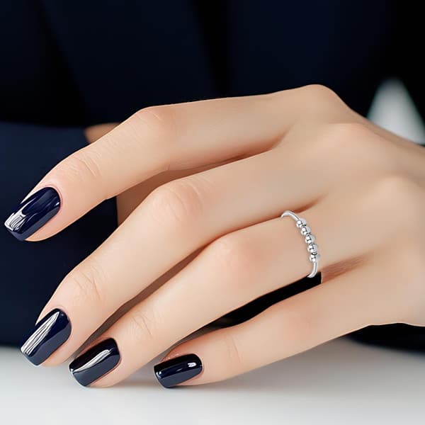 Justerbar antistressring med roterbara pärlor Silver
