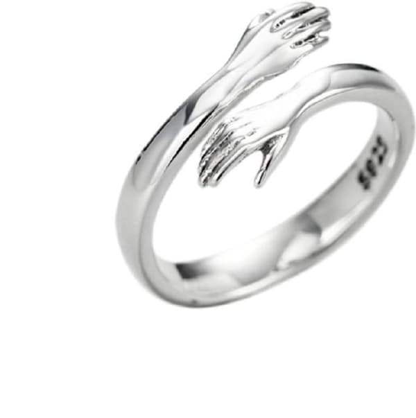 Fingerring med krammende hænder sølvfarvet 1-pack