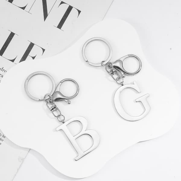 Moderne minimalistisk bogstavnøglering i rustfrit stål M