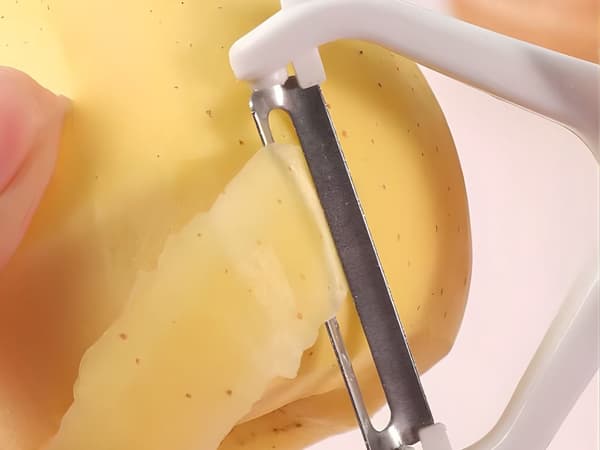 Grönsaksskalare dubbelblad ergonomisk