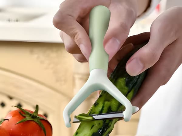Grönsaksskalare dubbelblad ergonomisk