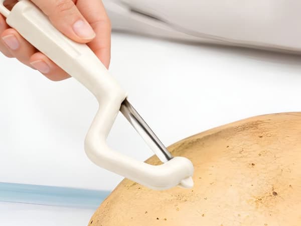 Grönsaksskalare dubbelblad ergonomisk