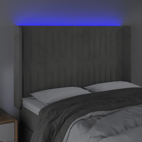 Sänggavel LED ljusgrå 147x16x118/128 cm sammet