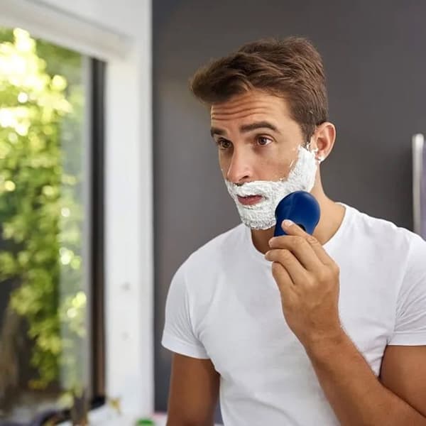 Vaskbar lommebarbermaskine med flydende