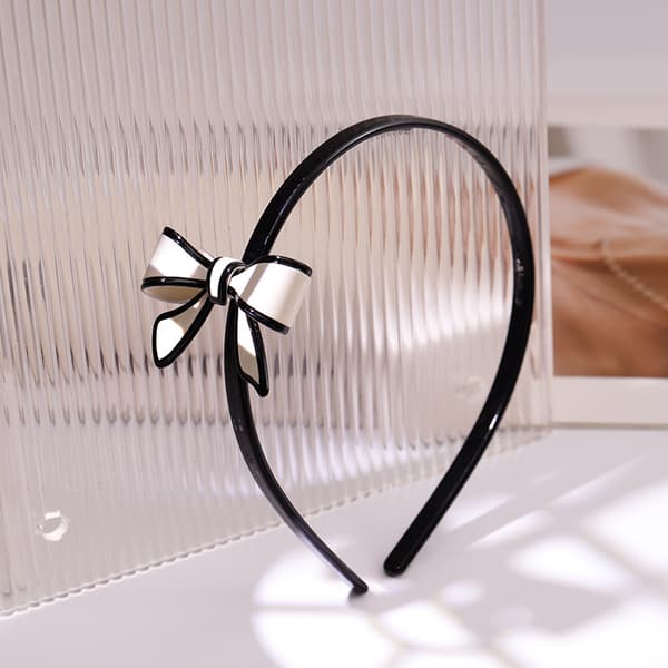 Elegant rosetthårband, svart och vitt, elastiskt håraccessoar