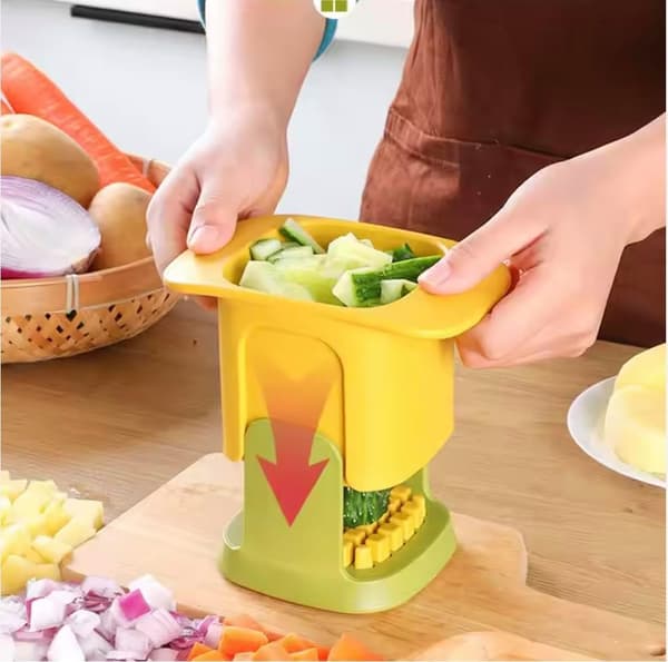 Grönsaksskärare och hackare, gul och grön, hackar snabbt frukt och grönsaker