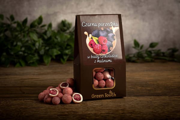 Frysetørrede sorte solbær i hvid chokolade med hindbær 80 g