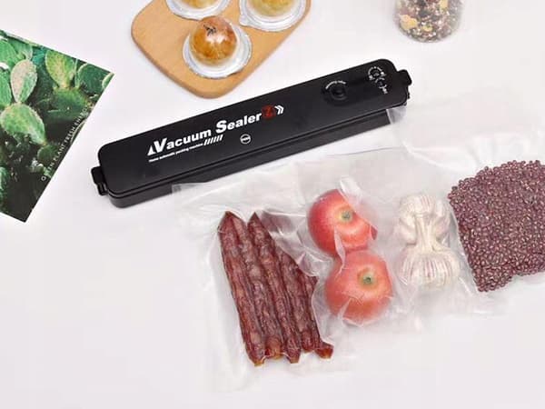 VAKUUMFORSEGLINGSMASKINE TIL FØDEVARER + POSER