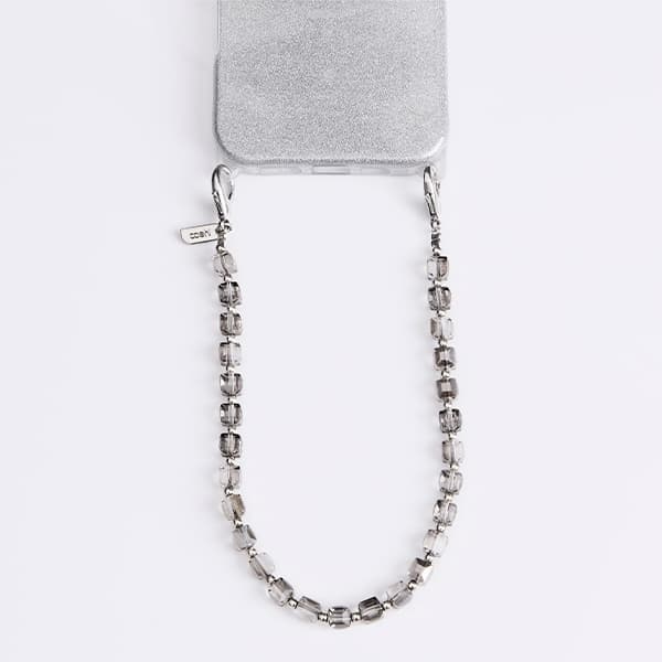 UNIQ Coehl Candy Gem Handstrap universal telefonsladd för handled silver/silver glittrande
