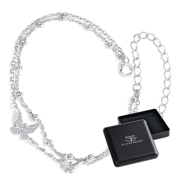 Dubbelt silverarmband med kristallfjärilar