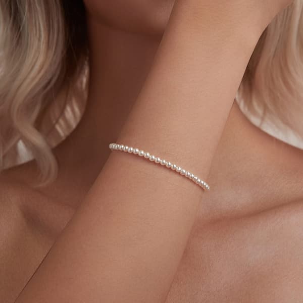 Elegant silverarmband med snäckskalspärlor, 925 silver