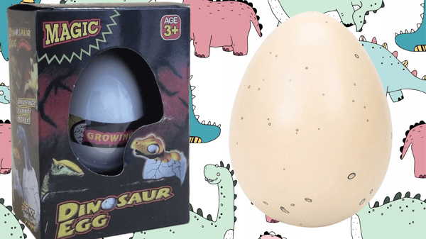 Stort dinosaurieägg kläckande dinosaurieägg