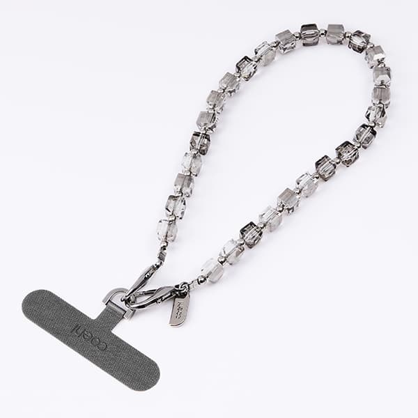 UNIQ Coehl Candy Gem Handstrap universal telefonsladd för handled silver/silver glittrande