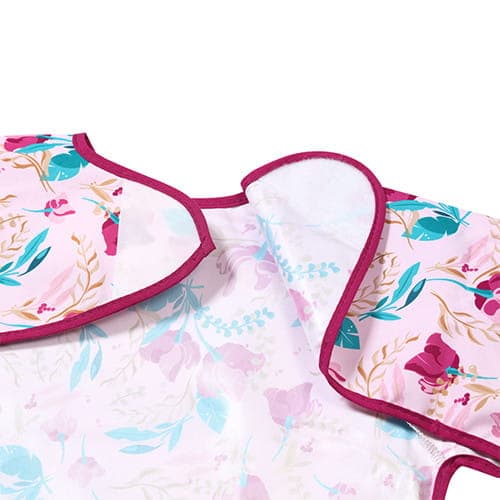 Blommig långärmad haklapp 2 år+, Babyono