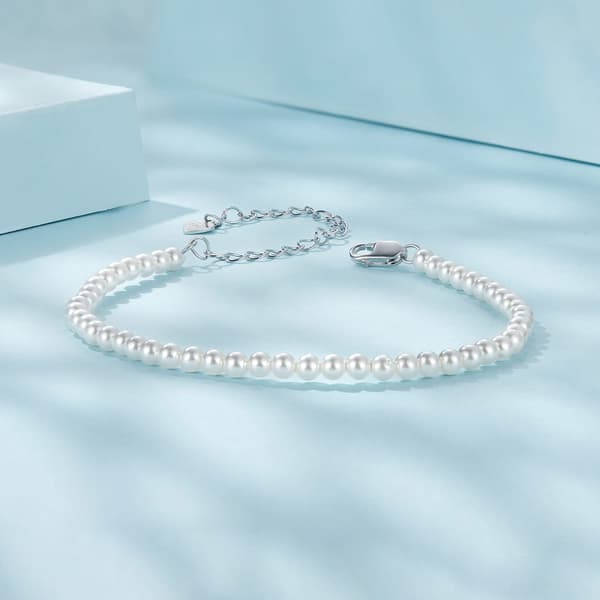 Elegant silverarmband med snäckskalspärlor, 925 silver