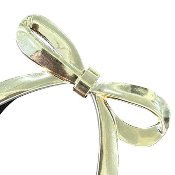 Elegant svart/guld elastisk hårsnodd med platt knut