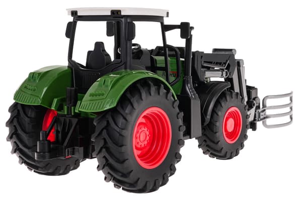 Grön traktor med grip