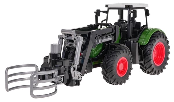 Grön traktor med grip