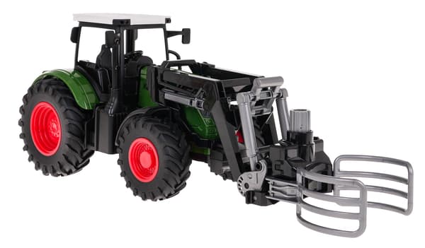 Grön traktor med grip