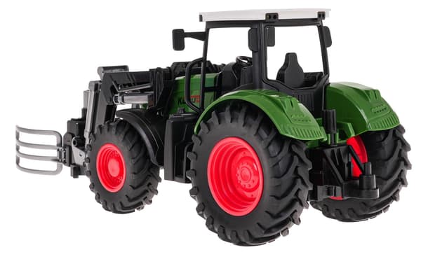 Grön traktor med grip