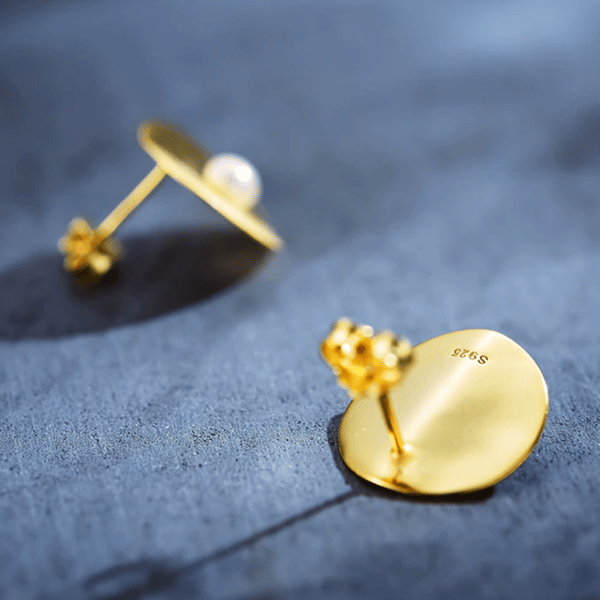 Pendientes de plata con perla dorada